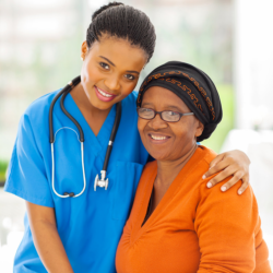 caregiver hugging patient wearing orange shirt