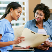 caregiver showing some results to patient