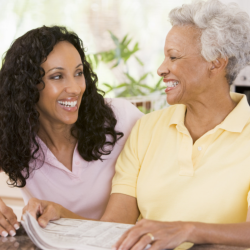 caregiver assisting patient in reading