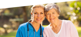 caregiver with stethoscope and patient smiling