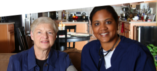 african american caregiver and patient smiling